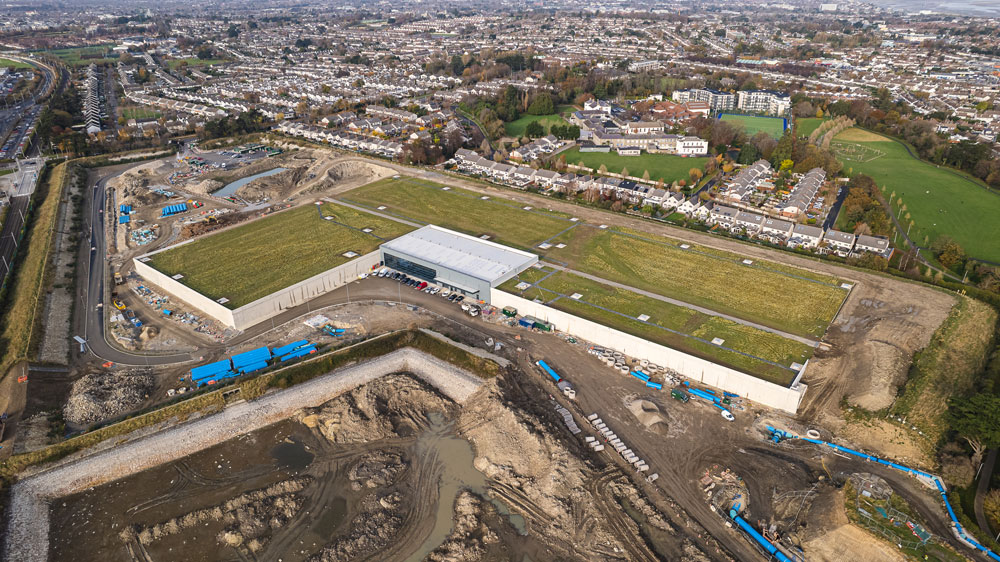 An aerial view of Stillorgan Reservoir surrounded by fields and houses.