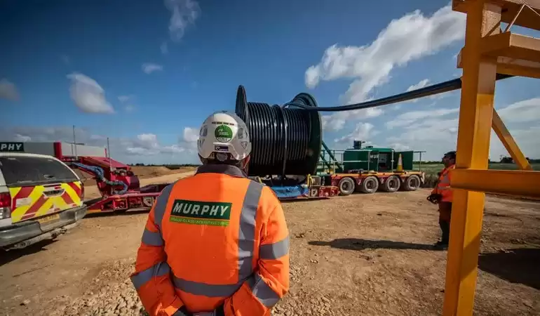 Two Murphy employees assisting with cable installation at Triton Knoll.