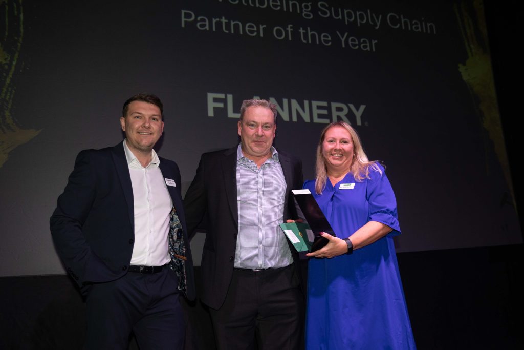 Two men and a woman celebrating an award win at the Murphy Supplier Awards 2024.