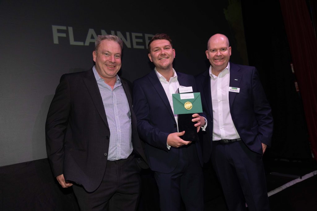 Three men celebrating an award win at the Murphy Supplier Awards 2024.