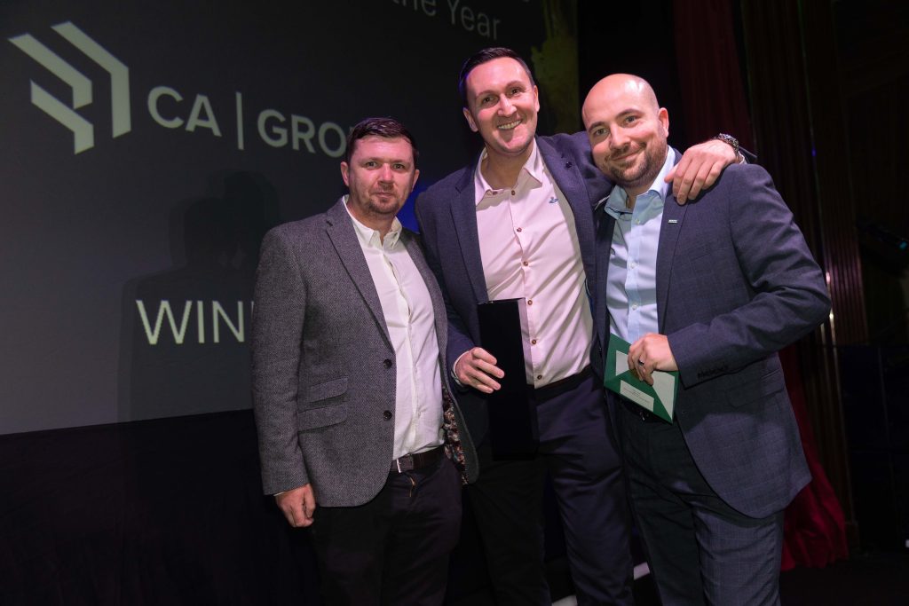 People in business dress posing for a photo at the 2024 Murphy annual Supplier Awards.
