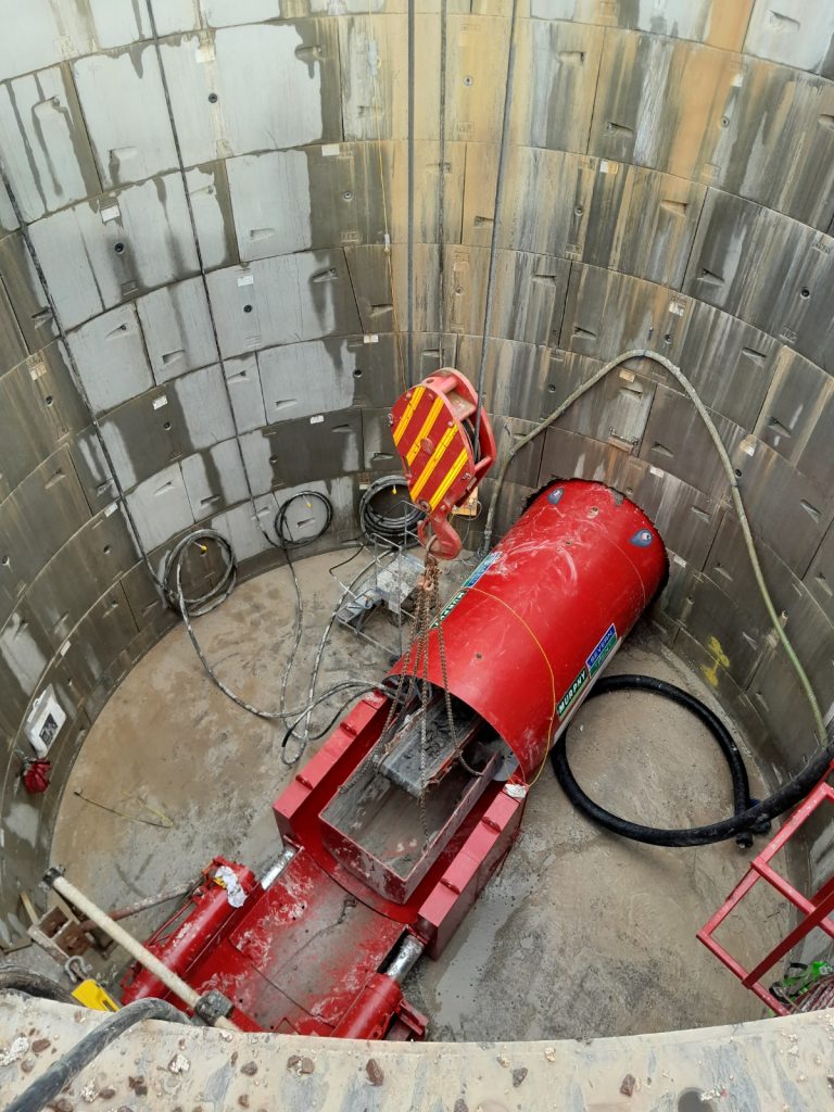 A red Murphy-branded pipe underground at the Hinckley to Hartshill Transfer Pipeline construction site.