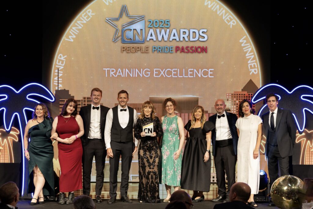 A group of people in formal dress onstage at the CN Awards 2025