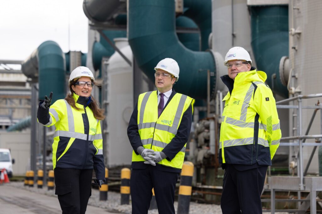 Three people wearing safety uniform at the Ringsend Waste Water Treatment Plant.