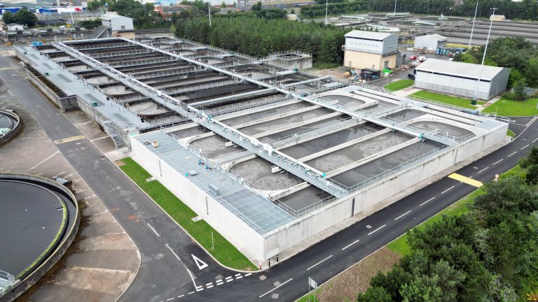 A wastewater treatment works from above in the daytime.
